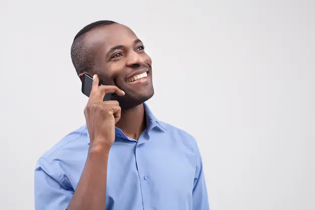 african man making phone call